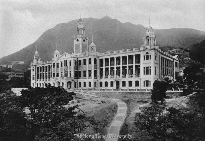 Historical black-and-white photograph of the HKU Main Building with a central clock tower set against Victoria Peak, captioned "The Hong Kong University."